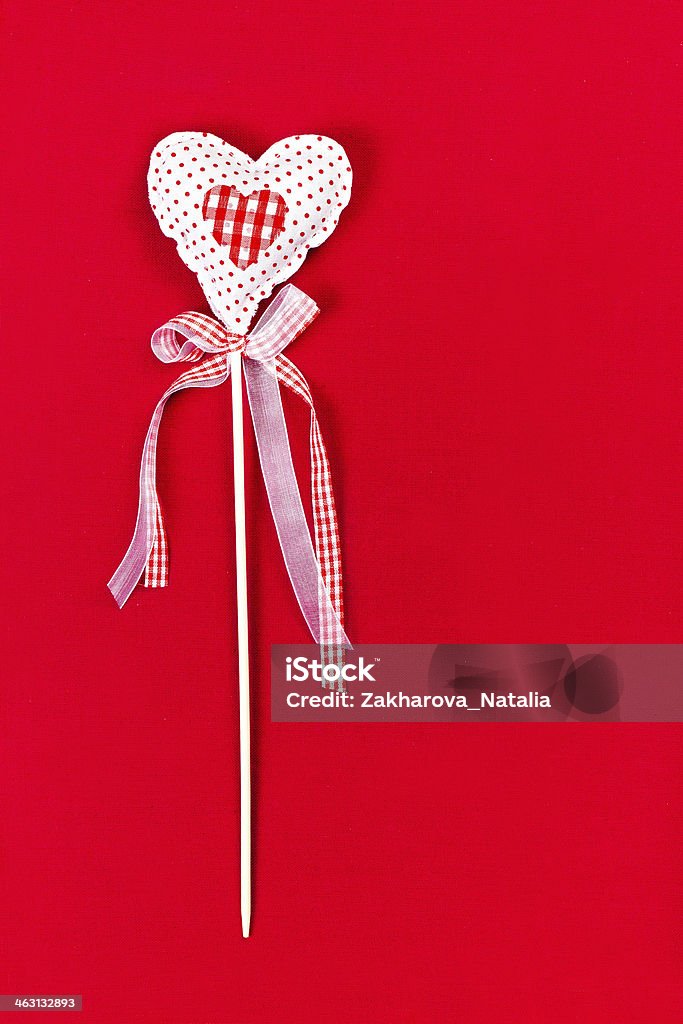 Valentines  Day Heart on Red Background with copy space. Valenti Valentines  Day Heart on Red Background with copy space. Valentine Love  background with rustic  heart on a stick. Vintage Valentines Card. Affectionate Stock Photo