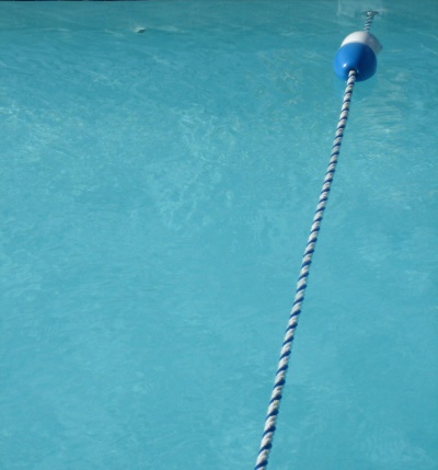 A rope and floatation buoy in a swimming pool