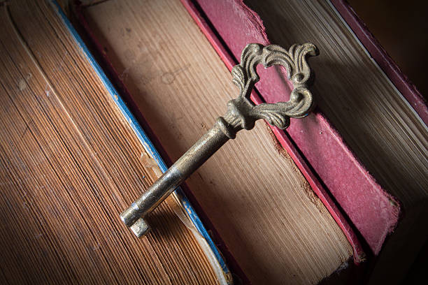istock Old key with antique books 463141567