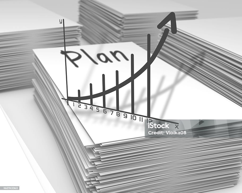 Plan graph concept Stacks of paper with a plan graph Budget Stock Photo