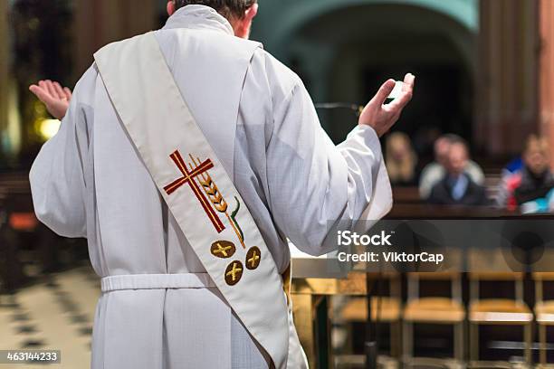 Priest At Podium During Ceremony Stock Photo - Download Image Now - Priest, Catholicism, Church