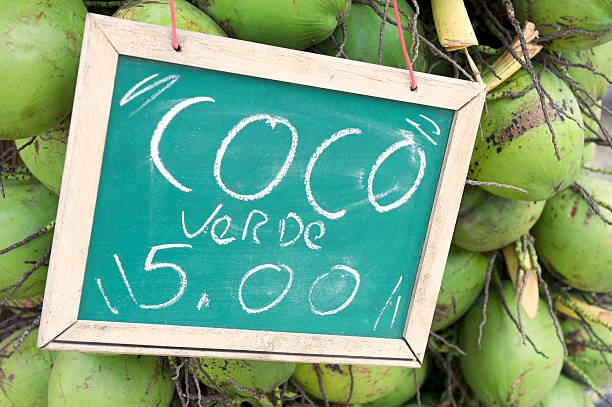 istock Green Drinking Coconuts for Sale Sign in Brazil 463158051