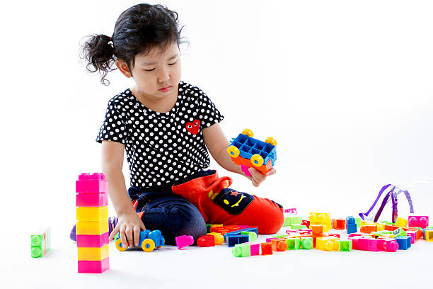 istock child playing blocks toy. 463158361
