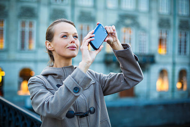 istock Elegant, young woman taking a photo 463158463