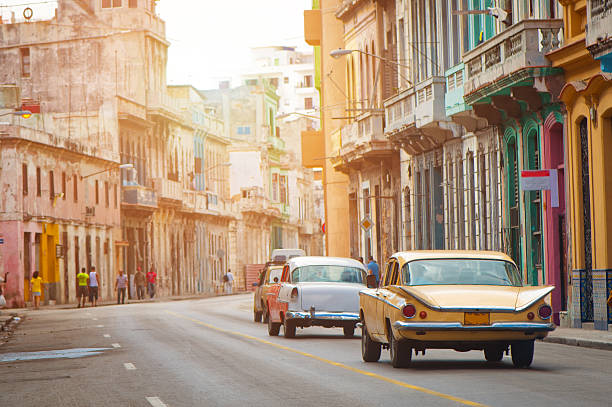 Old American cara driving at a street of old Havana, Cuba