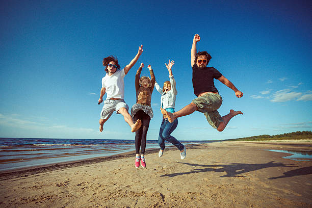 Friends at the beach. Fine film grain texture.
