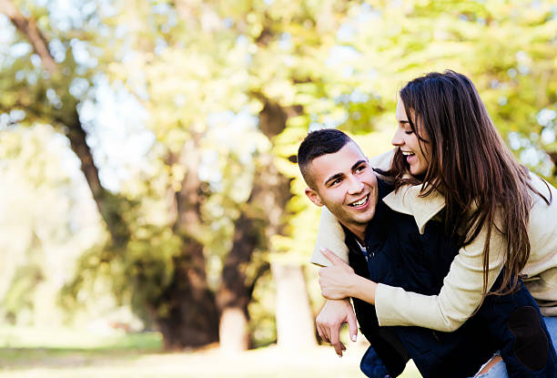 istock Cheerful couple in park 463179487