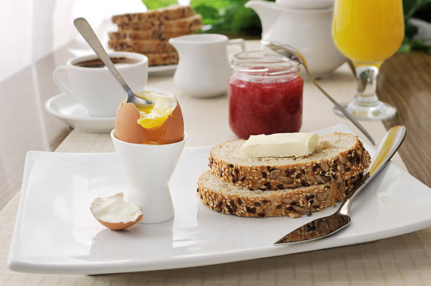 istock Breakfast soft-boiled egg and slices of oatmeal bread 463179717