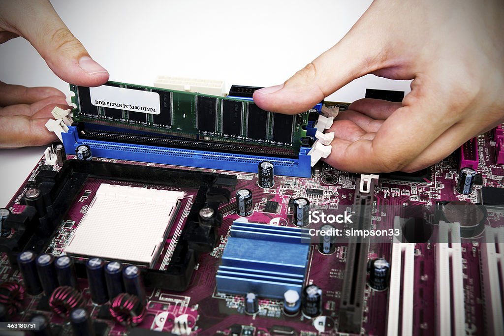 Man installing memory. PC motherboard RAM upgrade Repairing Stock Photo