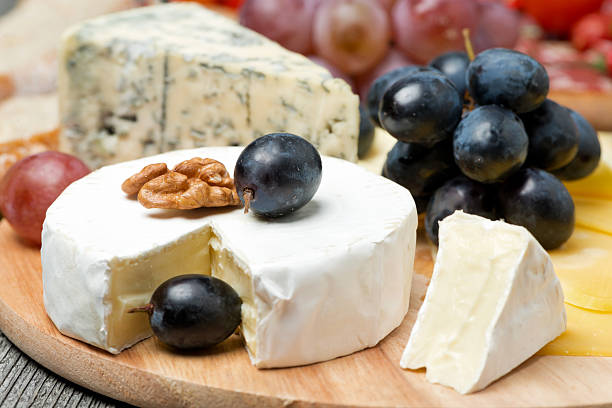 istock Camembert, blue cheese, grapes and walnuts, close-up, horizontal 463186361