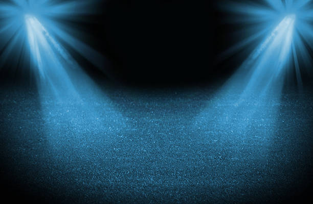istock Blue cold light soccer field, bright spotlights, illuminated stadium 463191021