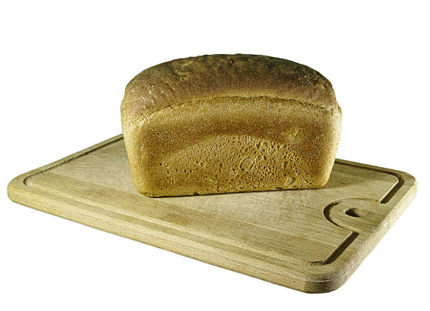 rye-bread on cutting board rye-bread on cutting board on white tilzit stock pictures, royalty-free photos & images