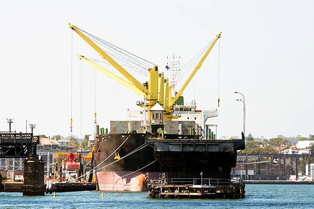 istock Barge with cranes anchored at port 463198777