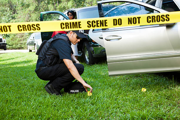 istock Policeman marks evidence after vehicle accident. 463206531
