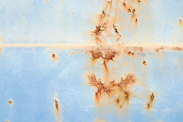 Rusty Blue Paint The photo shows a closeup view of the rusty sidedoor of a truck. distressed rusty vintage pickup truck close up detail stock pictures, royalty-free photos & images
