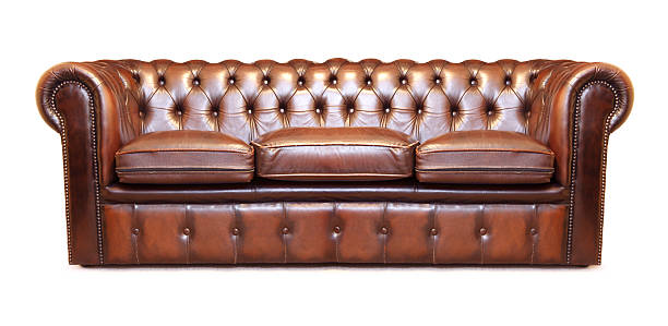 Big leather sofa Big leather sofa, isolated on white leather couch stock pictures, royalty-free photos & images