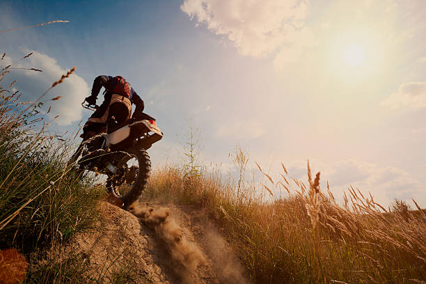 istock Motor cross rider on dirt track on sunny day 463214809