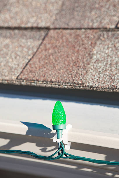 istock LED Christmas Light on House Roof Rain Gutter 463219119