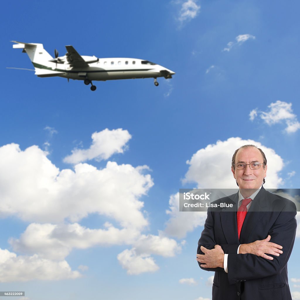Businessman and his Jet Businessman waiting for his jet Adult Stock Photo