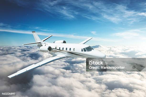 Jet Flying Above The Sky Stock Photo - Download Image Now - Corporate Jet, Flying, Mid-Air