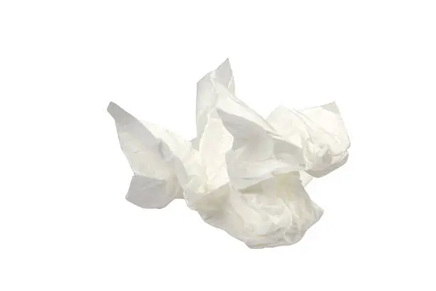 Photo of used paper tissue on white