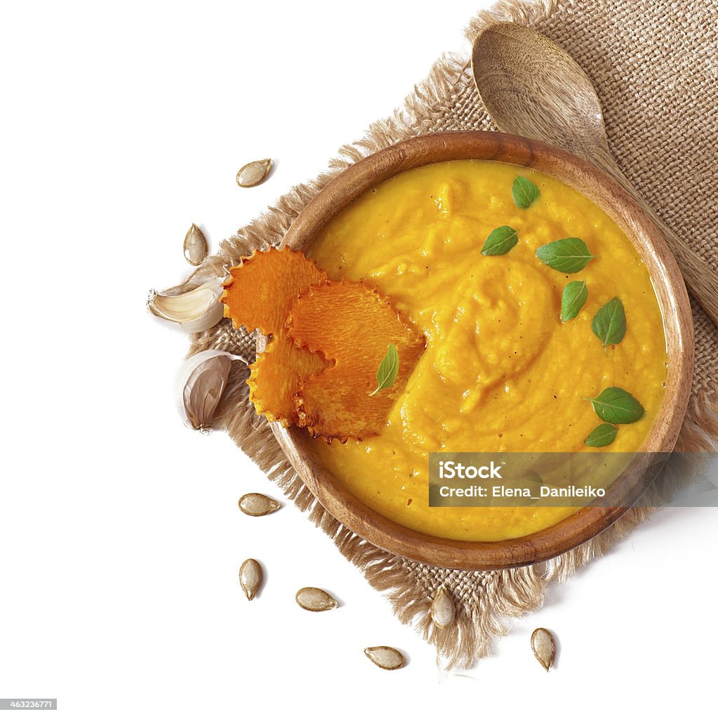 Cream of pumpkin soup in a wooden bowl Appetizer Stock Photo