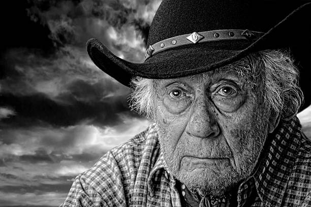 istock old cowboy against a stormy sky 463237075