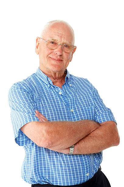 istock Happy elderly man standing with his arms crossed 463242979