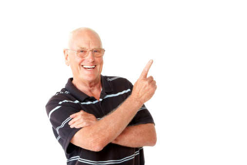 Portrait of cheerful senior man showing copyspace on white background