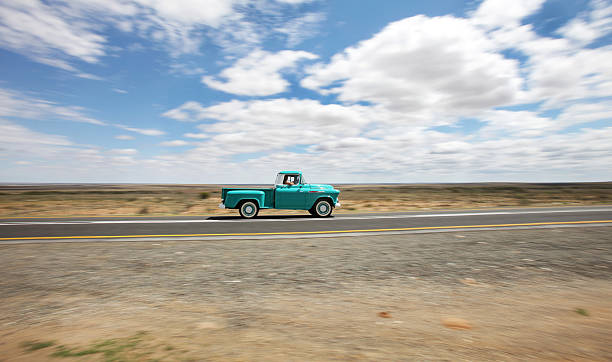 green vintage truck on an open road