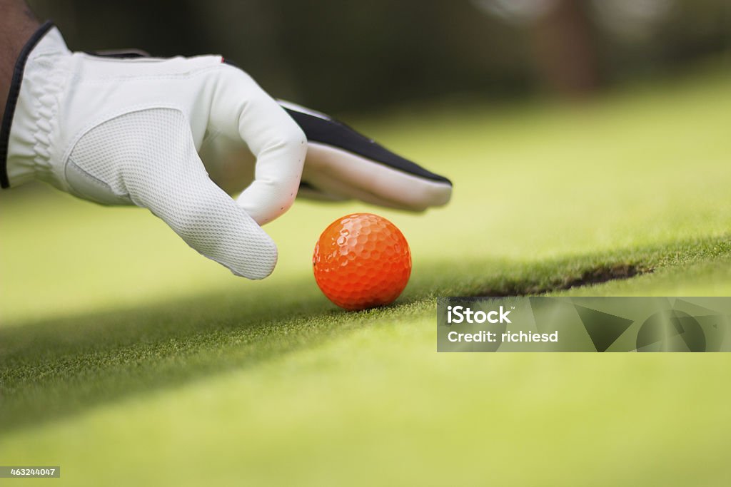 Orange golf ball Orange golf ball - outdoors Beauty In Nature Stock Photo