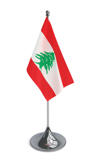 Desktop flag of the Lebanese Republic isolated on white. CG-image.