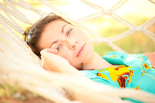 istock beautiful girl relaxes in a hammock 463260367