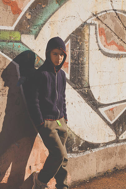 istock Boy portrait with Graffiti Wall as background 463261259