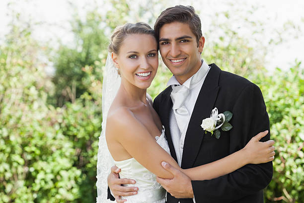 istock Pleased classy young newlyweds embracing 463261535