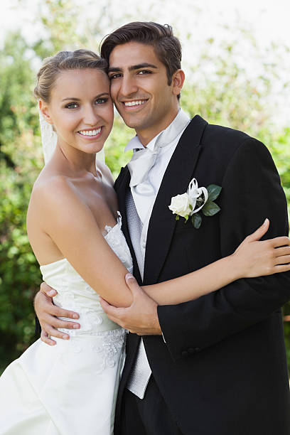 istock Cheerful classy young newlyweds embracing 463261543