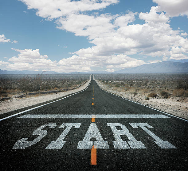 istock Starting line painted on long straight desert highway 463261823