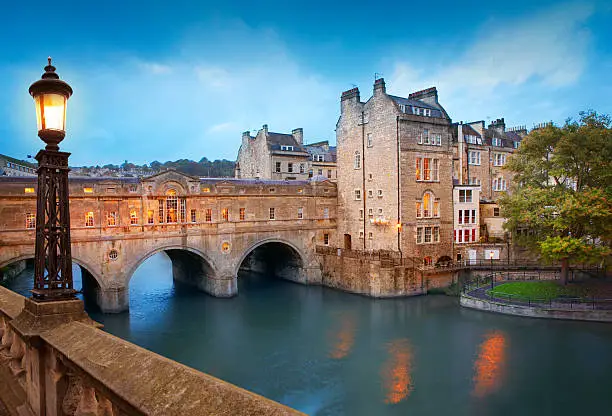 Pulteney Bridge by dusk, the main tourist attraction in Bath, UK.