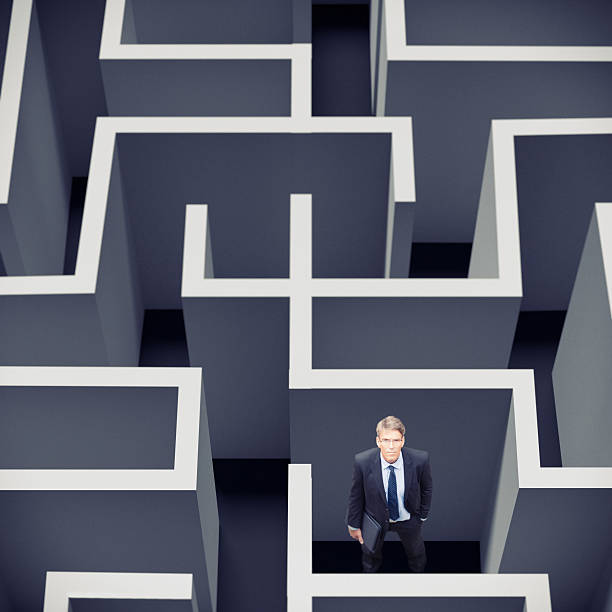 istock businessman stuck in a maze 463270055