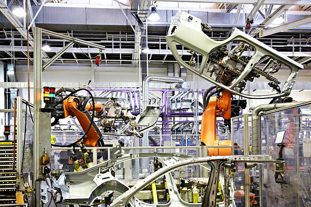 robots in a car factory robotic arms in a car factory production line automobile industry car plant car stock pictures, royalty-free photos & images