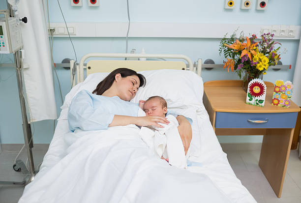 istock Mother and baby sleeping in the same bed 463270571