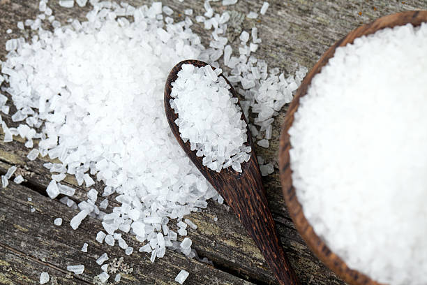 istock sea salt on wooden table 463272075