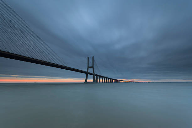 istock Dawn at the Vasco da Gama Bridge in Lisbon. 463274257