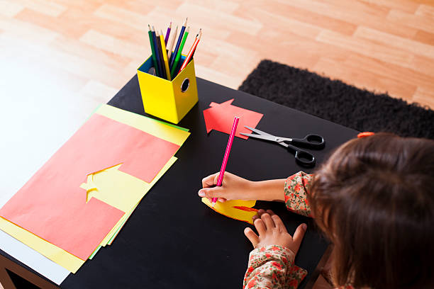istock Little girl drawing at school 463277133