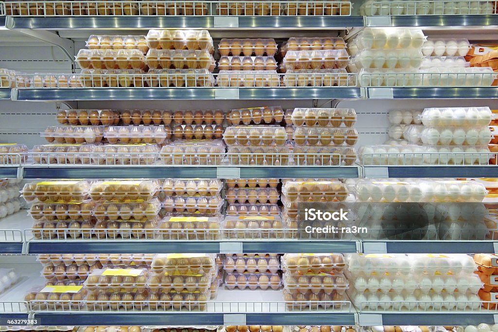 Chicken eggs on supermarket shelves Packaging of chicken eggs on supermarket shelves cooled Animal Egg Stock Photo