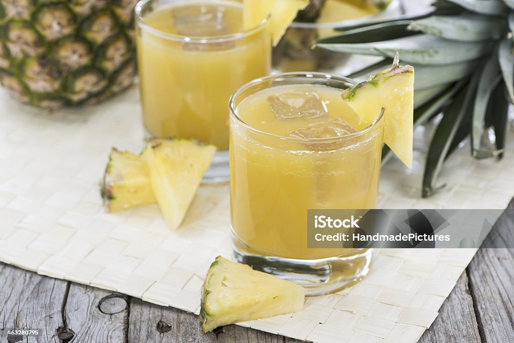 Portion of fresh Pineapple Juice Portion of fresh Pineapple Juice in a glass Pineapple Stock Photo