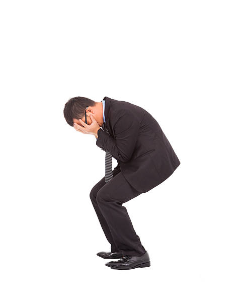 istock suffering businessman squat to feel disappointment 463290453