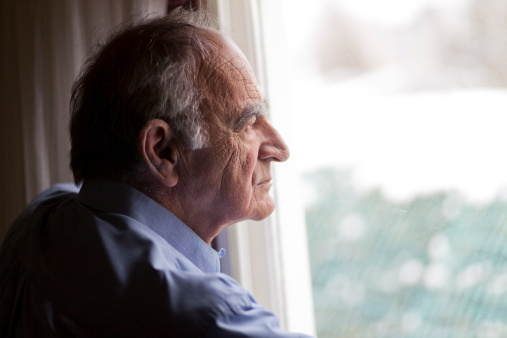 Close up of a senior man contemplating