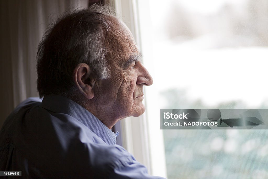 Close-up of a senior man contemplating Close up of a senior man contemplating Senior Men Stock Photo