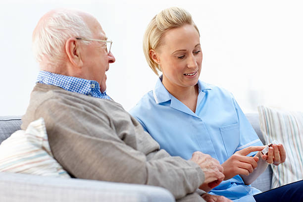 istock Senior receiving instruction from a nurse 463302367